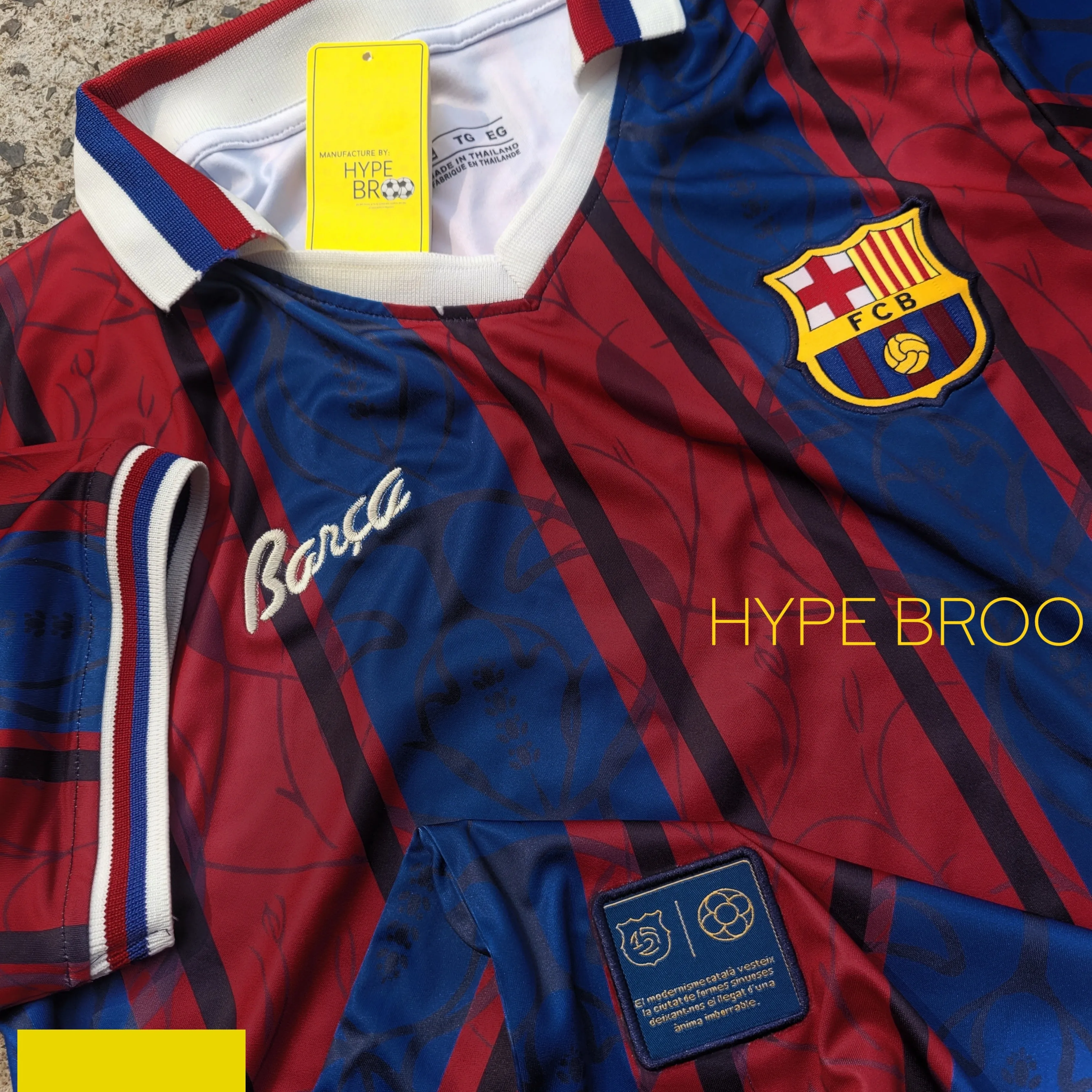 Close-up of FC Barcelona crest and 125 years anniversary embroidery on jersey