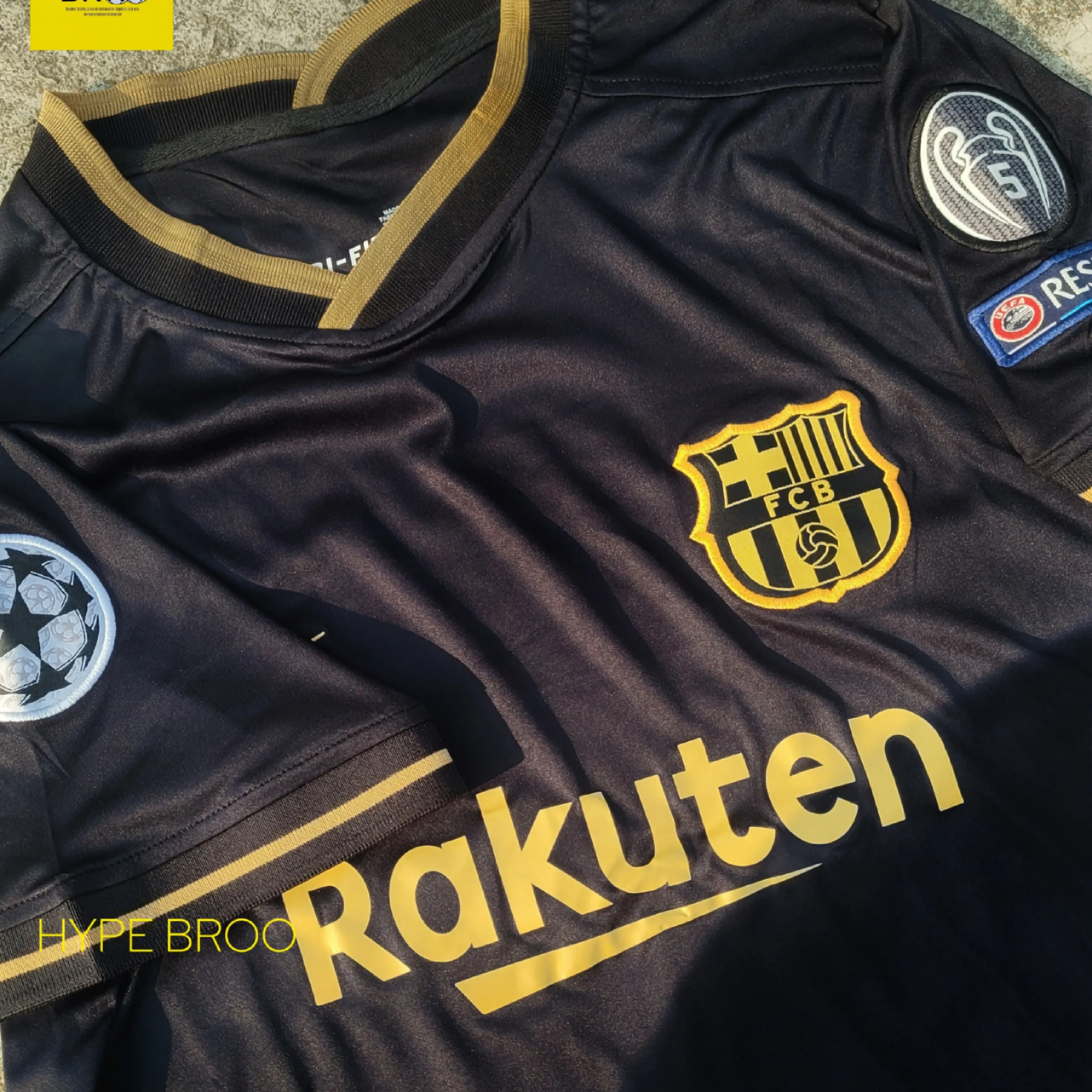 Close-up of Barcelona crest with Nike logo and Champions League patches on 2020-21 away kit