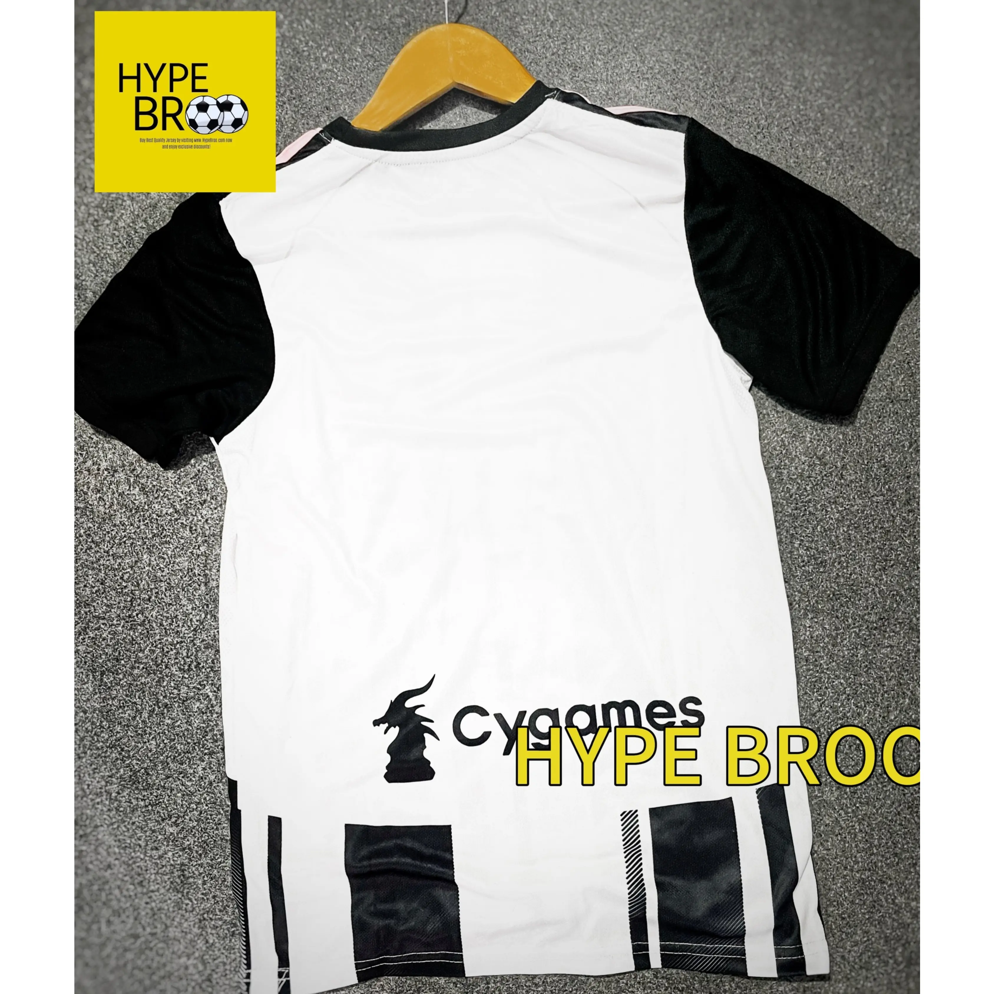 Juventus 2025-26 home jersey back view laid on carpet with hanger
