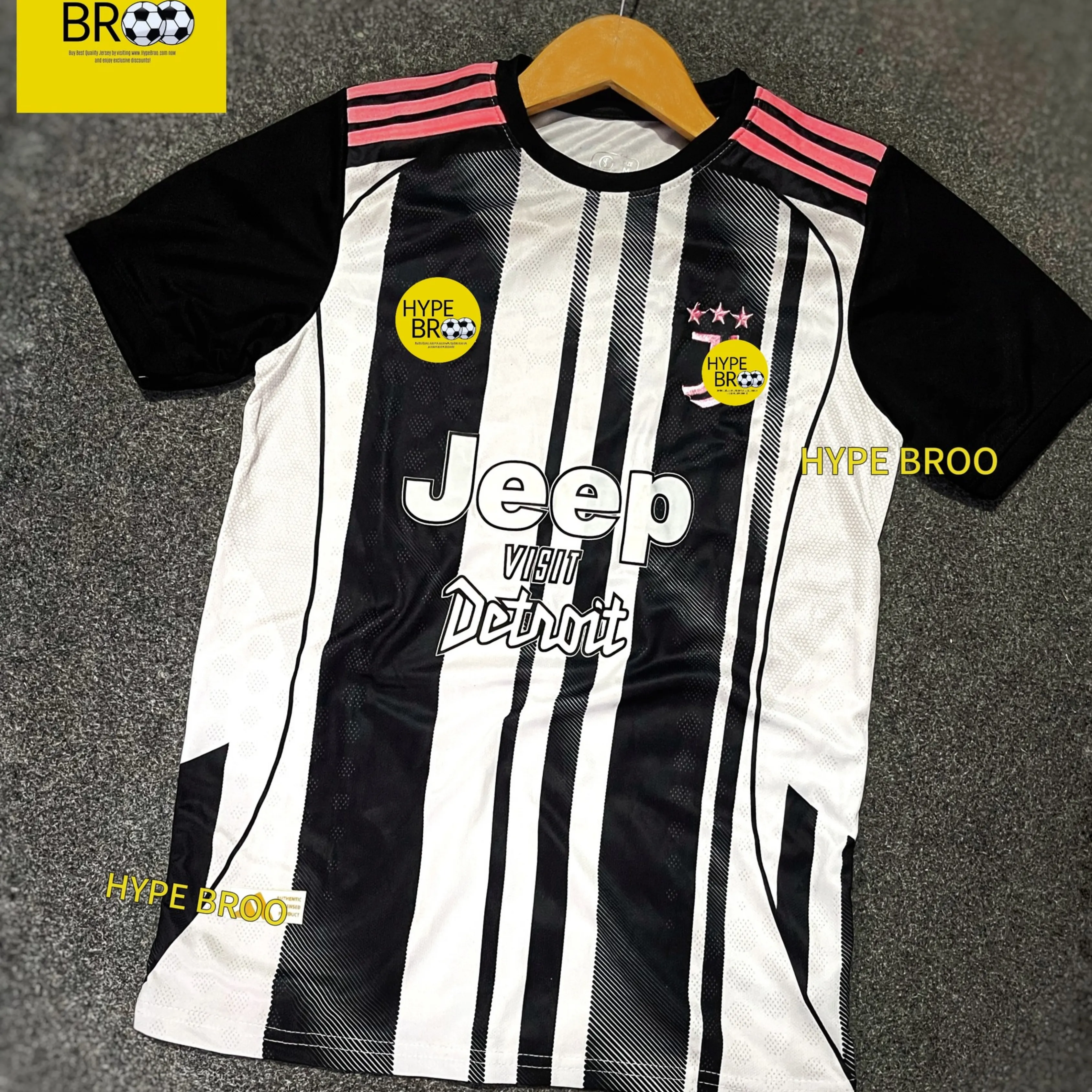 Juventus 2025-26 home jersey front view laid on carpet with hanger