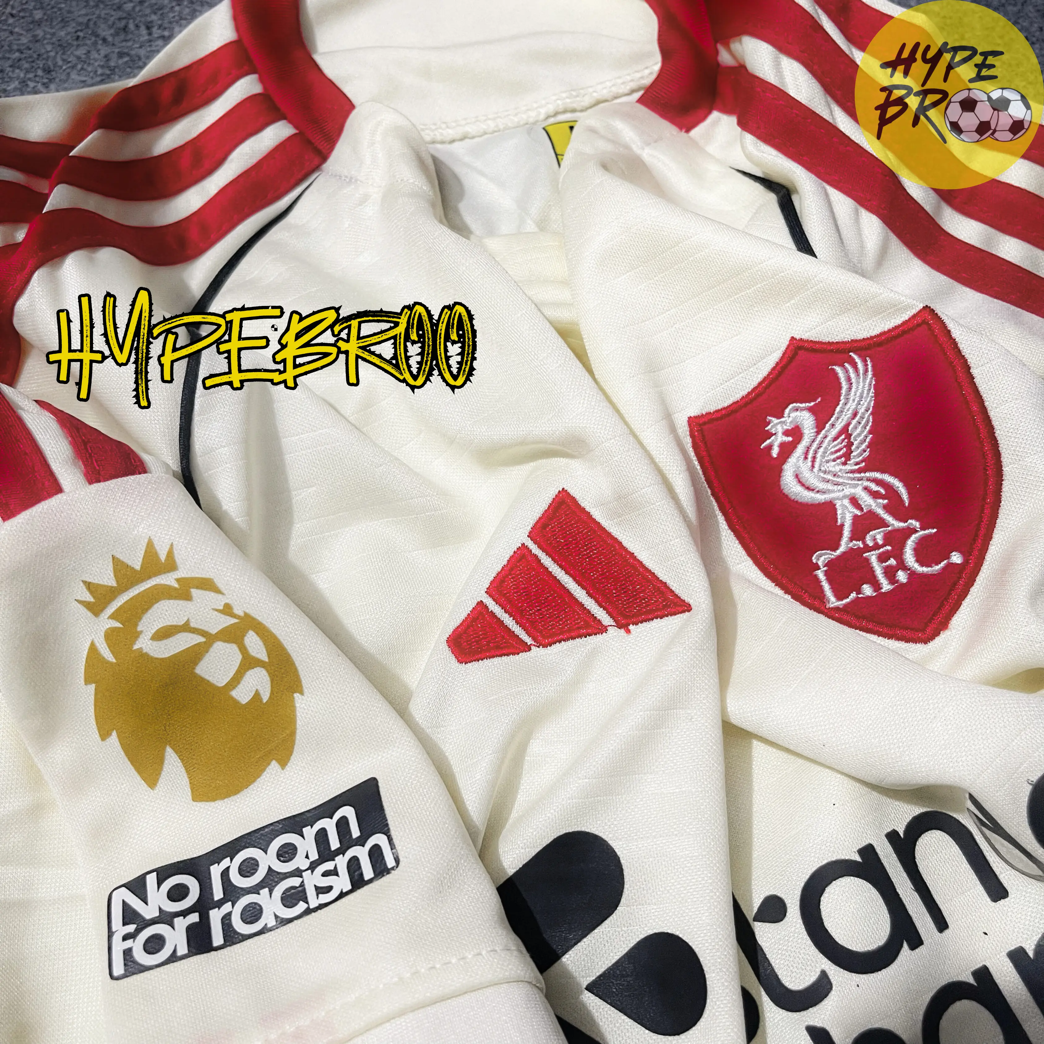 Close-up of Liverpool crest and Adidas logo on 2025-26 away kit
