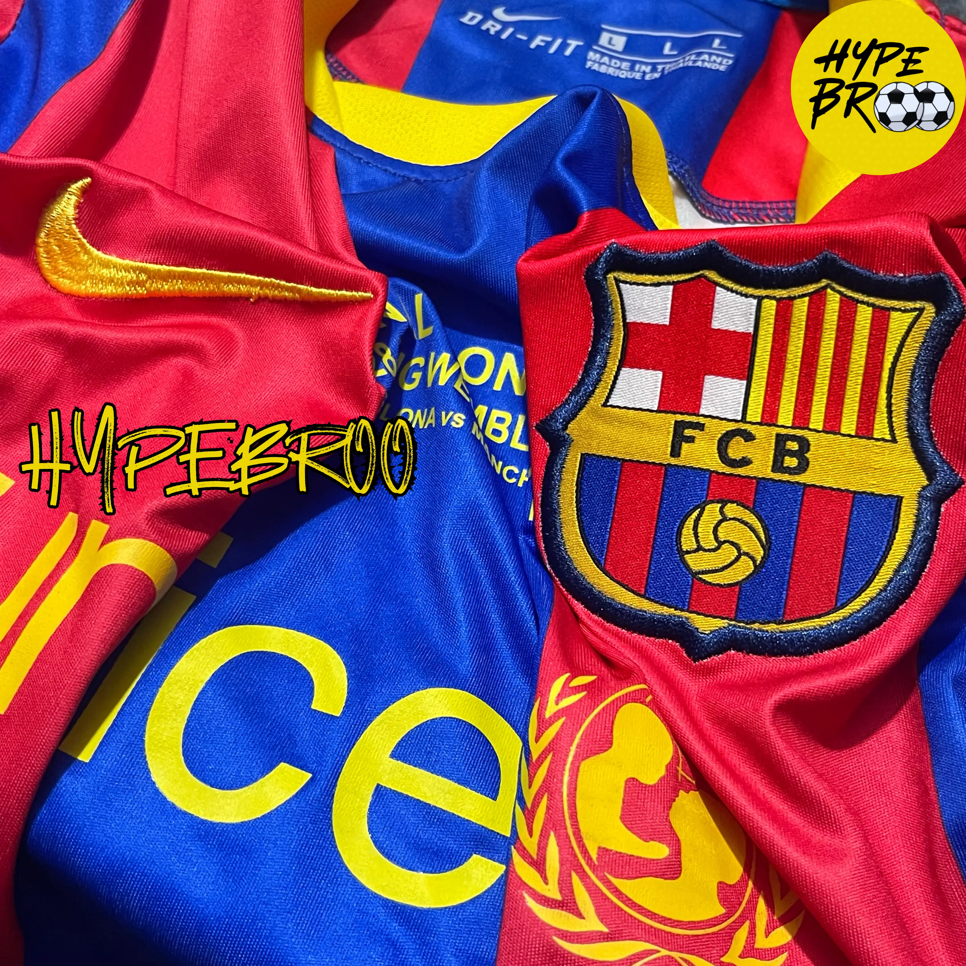 Close-up of Barcelona crest, Nike logo, and Champion patch on 2010-11 home kit