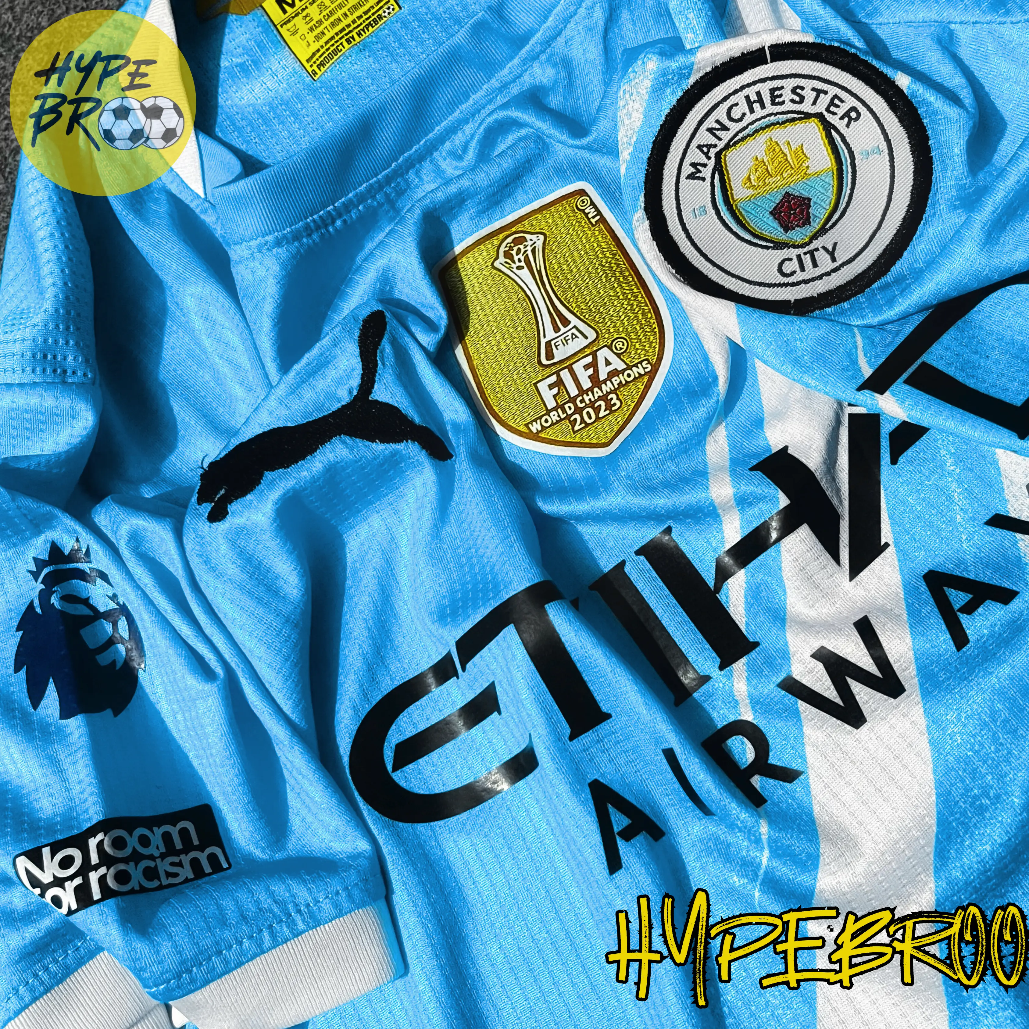 Close-up of Manchester City crest and Puma logo on 2025-26 home kit