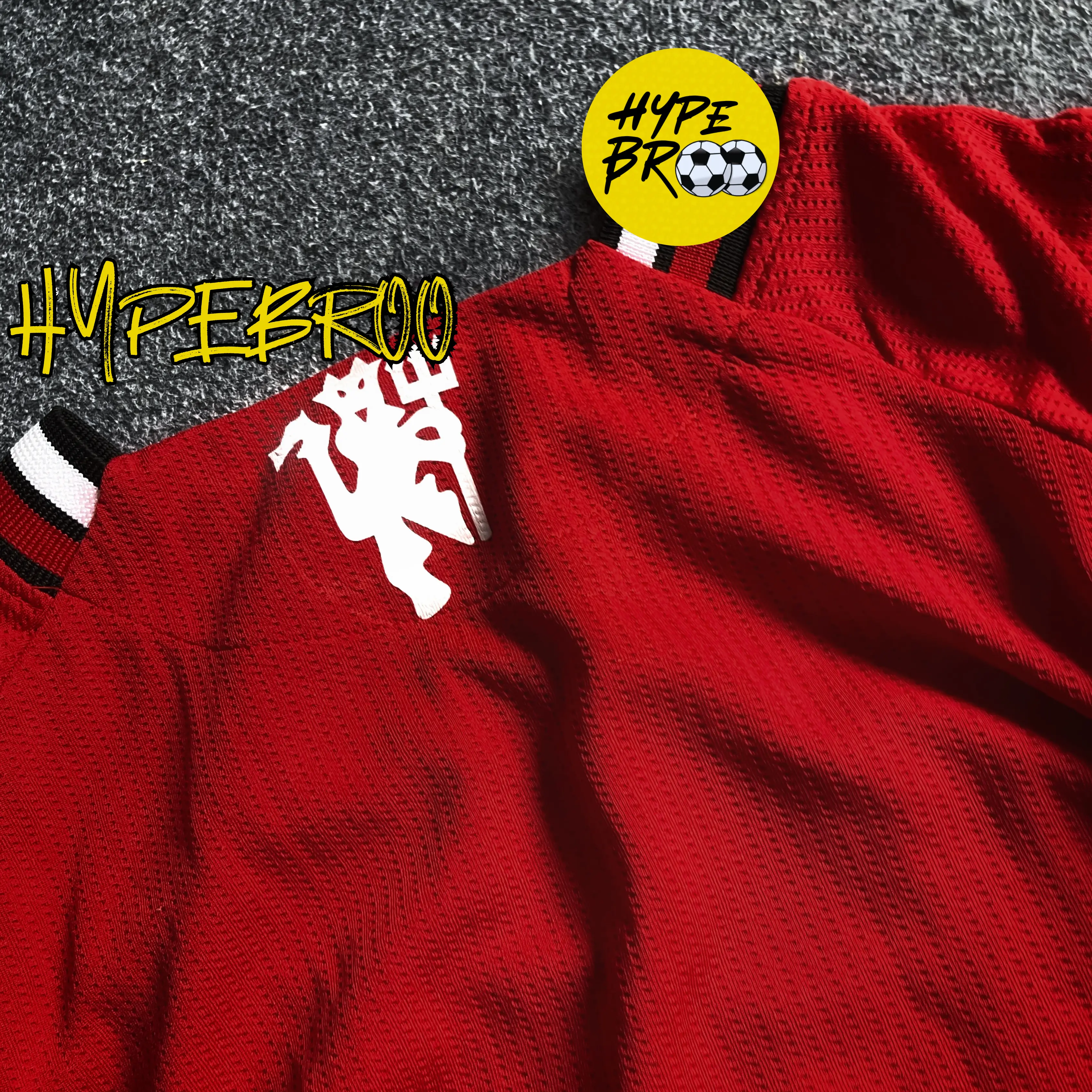Zoom close-up of Manchester United 2025-26 home jersey red devil backside sticker