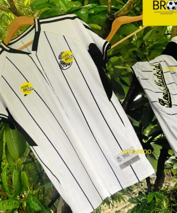 Real Madrid travel kit shirt front and back hanging on tree branch